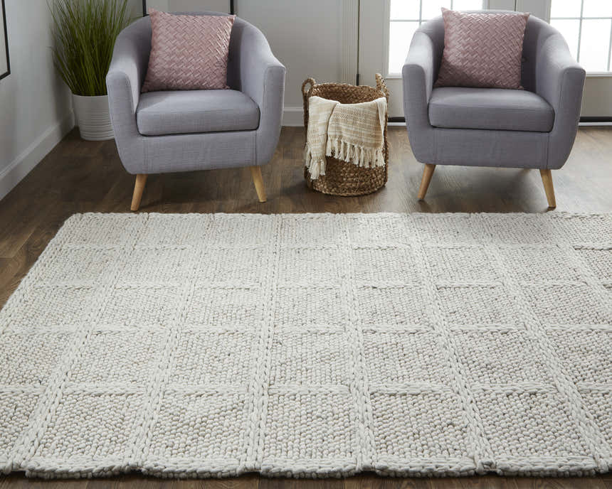 Living room scene with Feizy Berkeley ivory/gray rug, gray chairs, and woven basket. Roomscene-Rectangle