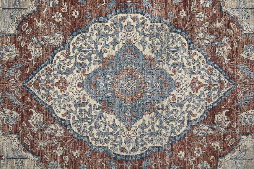 Close-up of the Feizy Marquette Transitional Medallion Area Rug; gray, red, and blue vintage-style floral pattern. Texture