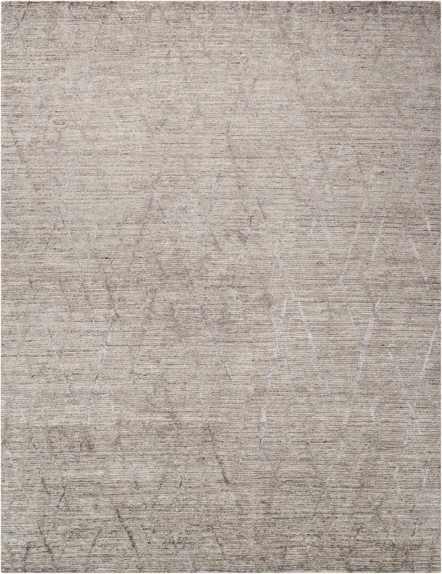 Close-up of the handmade Nourison OCEAN Ash area rug; a modern rug with a subtle geometric pattern and textured design.