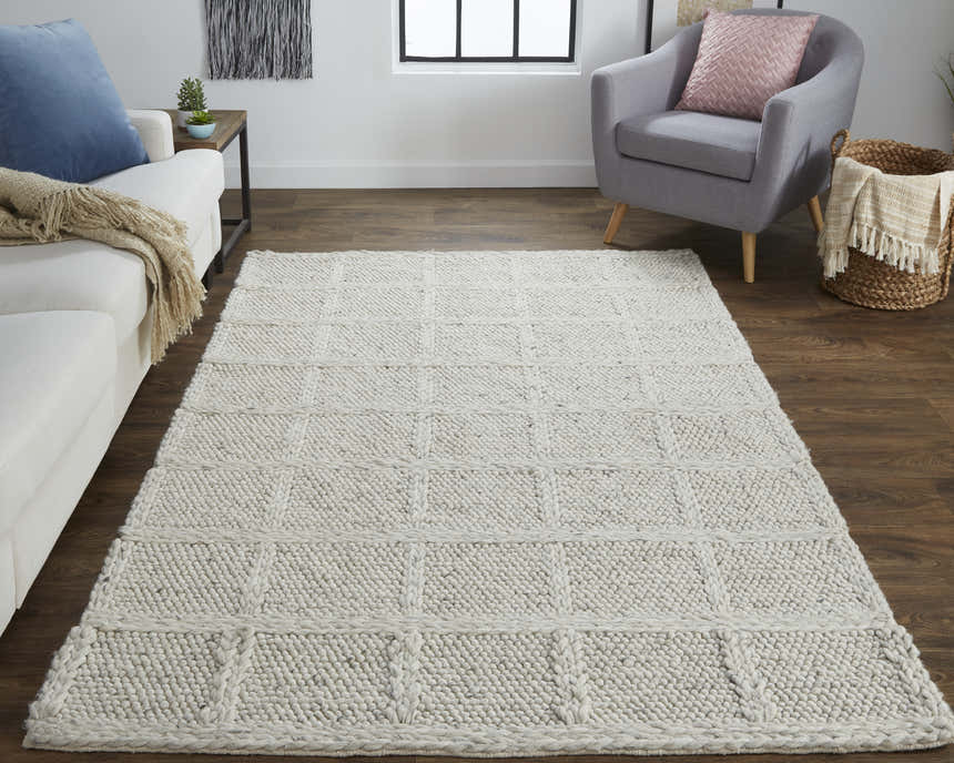 Living room scene with Feizy Berkeley ivory and gray wool rug. Casual setting with sofa, chair, and wood floors. Roomscene-Rectangle