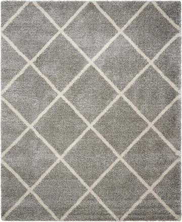 Close-up of the Nourison Brisbane Ash Shag rug. The rug has a soft texture and a geometric diamond pattern.