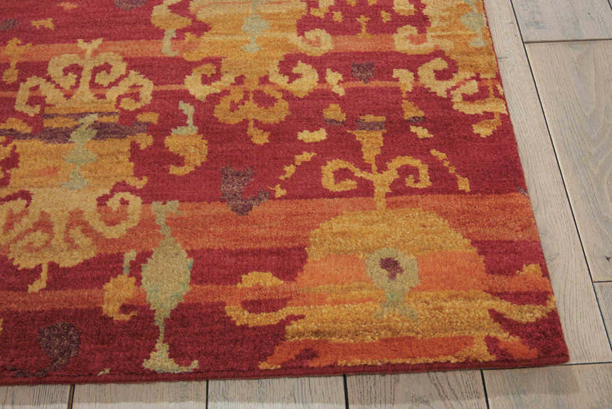 Close-up of the flame-colored Nourison Dune Persian rug, showcasing its handmade wool texture and traditional design.