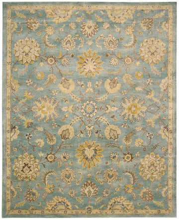 Close-up of Nourison Jaipur Light Blue Persian rug. Features a floral pattern in light blue, yellow, and brown tones.
