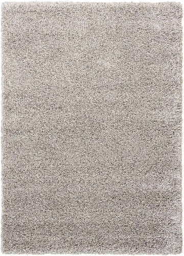 Close-up of a soft, light gray shag texture on the Nourison Amore area rug. Clearance item.