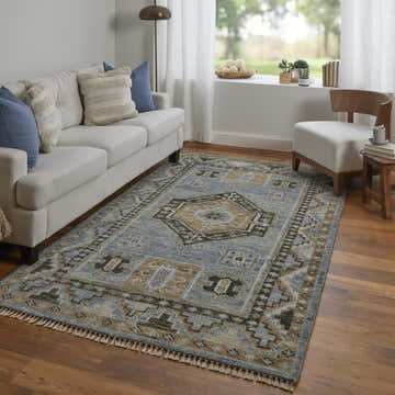 Living room scene with a Feizy Fillmore Traditional Medallion rug in blue and green, white sofa, and wood chair. Roomscene-Rectangle
