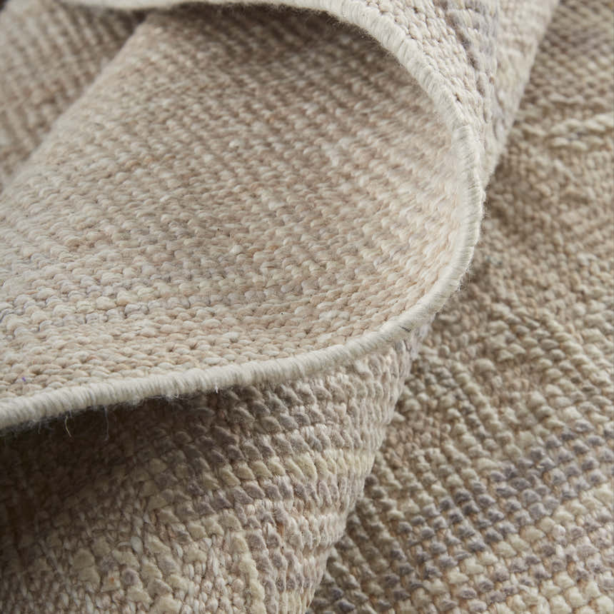 Close-up of the hand-knotted Feizy Wendover Tan/Brown Area Rug showing its texture, neutral colors, and transitional style. Fold