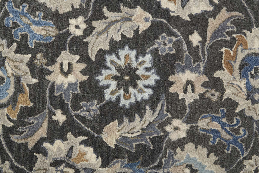 Close-up of the Feizy Rylan Transitional Oriental Rug. Taupe, blue, and ivory floral pattern on a hand-tufted wool rug. Texture