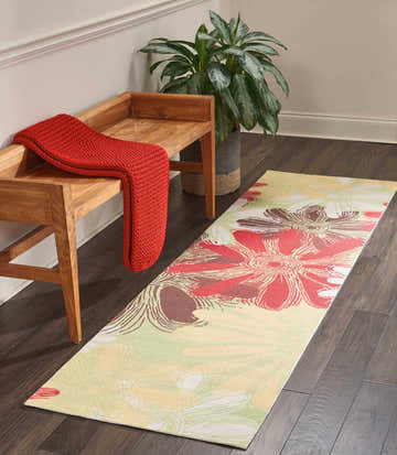 Hallway scene with Nourison Home & Garden Green Contemporary Area Rug, wood bench, red throw, and potted plant.