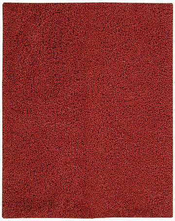 Close-up of the Nourison Zen Red Shag Rug showing its dense, soft texture and rich red color. Handmade shag rug detail.