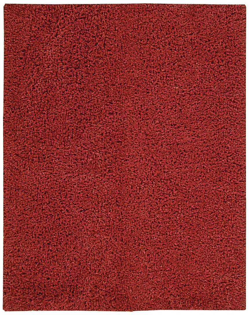 Close-up of the Nourison Zen Red Shag Rug showing its dense, soft texture and rich red color. Handmade shag rug detail.