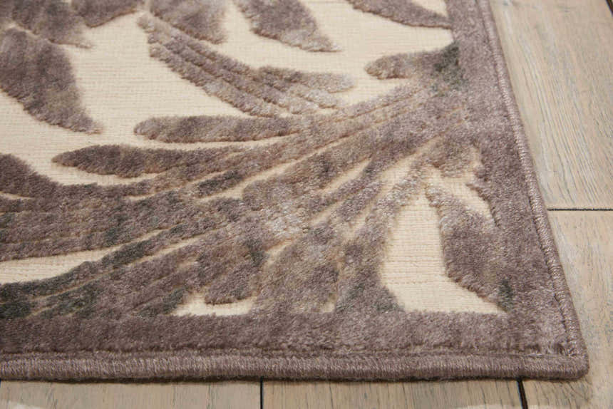 Close-up of Nourison Graphic Illusions Ivory runner rug with chestnut abstract floral pattern and textured pile.