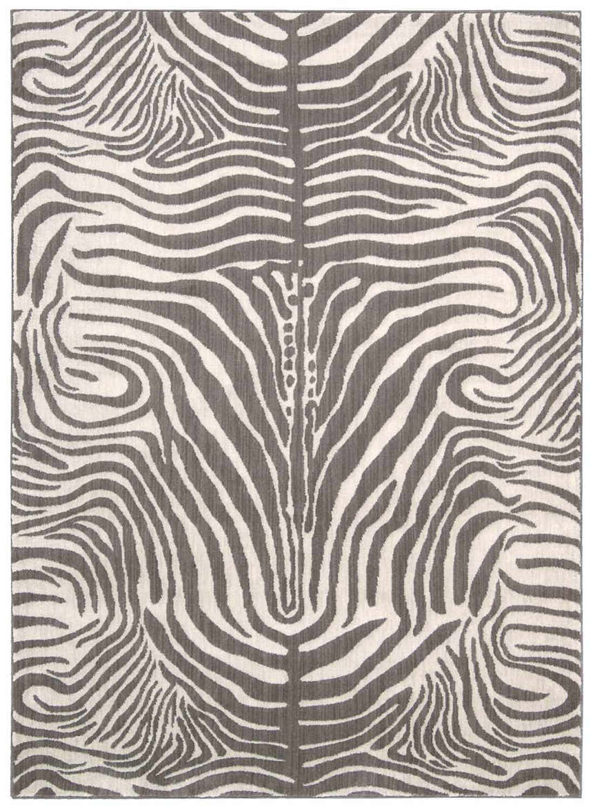 Close-up of Barclay Butera Madagascar Graphite rug featuring a gray and white zebra stripe pattern.