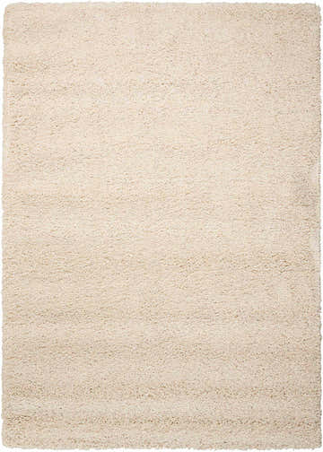 Close-up of the cream-colored, rectangle Nourison Amore Shag Rug. The texture is soft and plush.