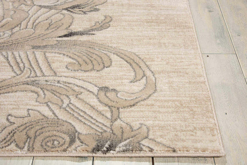Close-up of Nourison Maxell Mocha rug showing light brown floral pattern and soft texture on a light wood floor.