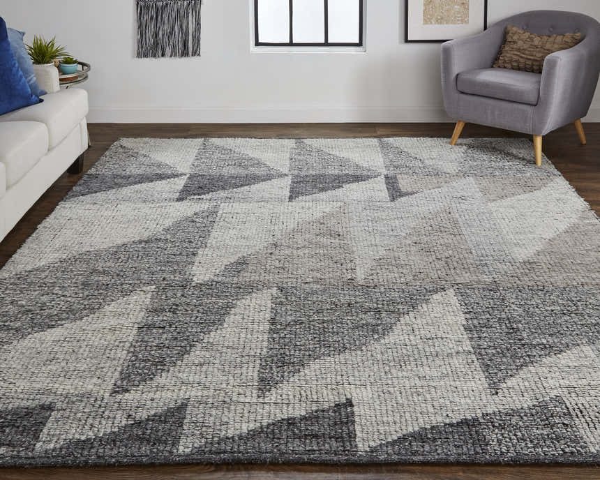 Living room with Feizy Alford Ivory/Gray/Taupe rug, white sofa, gray chair, and geometric wall art. Roomscene-Rectangle