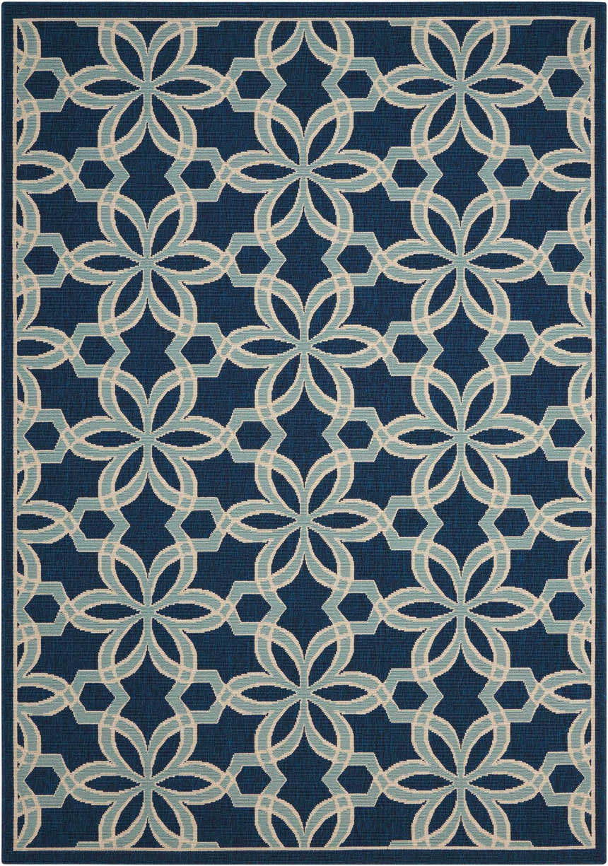 Close-up of the Nourison Caribbean Navy Contemporary Area Rug featuring a geometric floral pattern in navy, light blue, and cream.