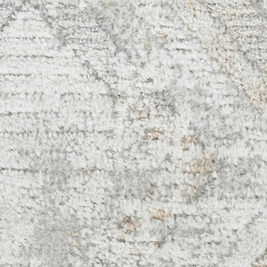 Close up of the high pile Nourison Dekor Grey area rug, showing texture and subtle pattern.