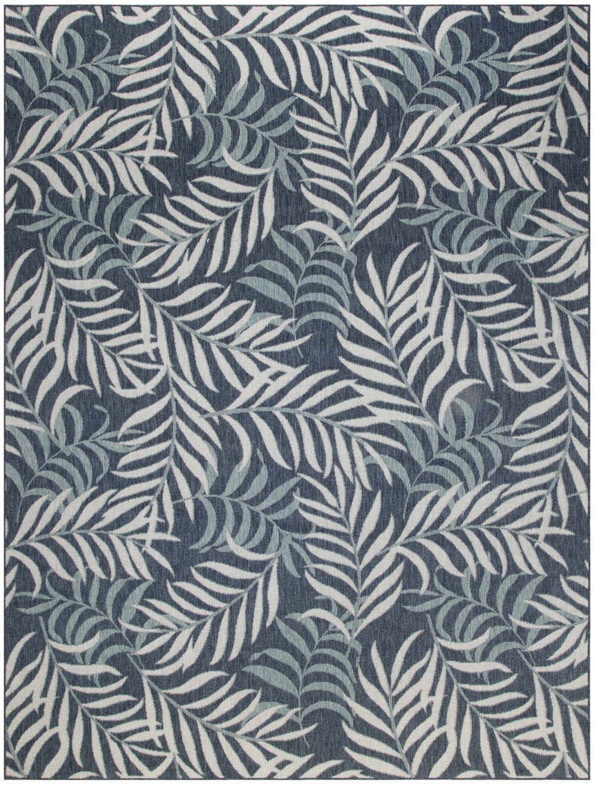 Close-up of the Nourison Garden Oasis Navy Tropical Area Rug featuring a dense leaf pattern in navy, white, and gray.