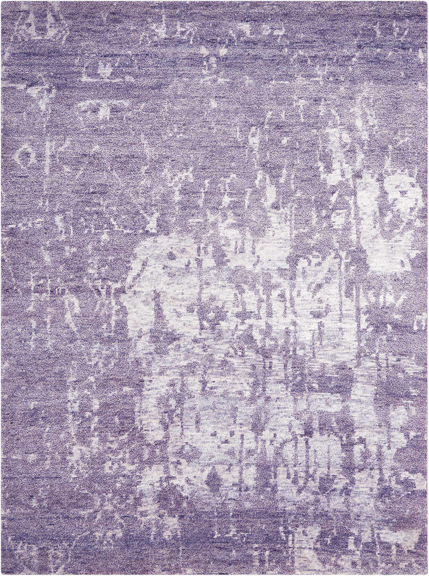 Close-up of the Nourison Silk Shadows Amethyst Vintage Area Rug, showcasing its purple hues and distressed vintage pattern.