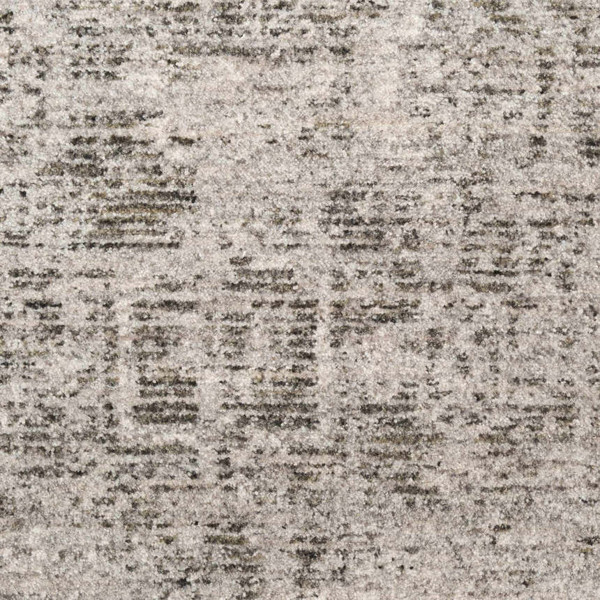 Close-up of the DKNY Pure Shades Grey Vintage Indoor Area Rug showing its subtle pattern and soft pile.