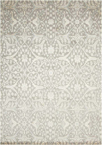 Close-up of the Nourison Luminance Steel Vintage Area Rug with light blue accents and a floral and bird pattern.