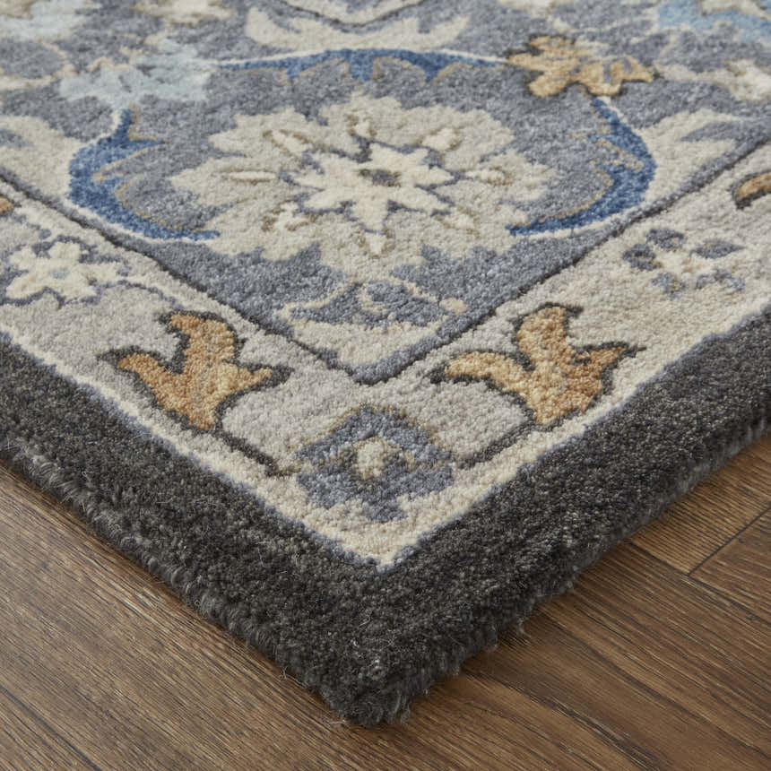 Close-up of the Feizy Rylan Taupe/Blue/Ivory Area Rug showing the wool texture and transitional oriental pattern. Corner