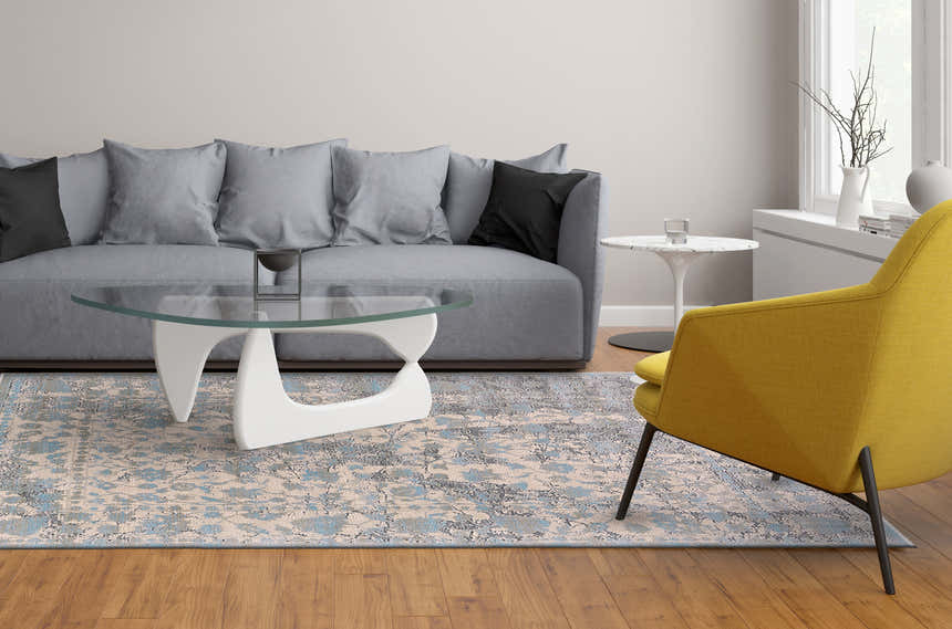 Living room scene with Feizy Prasad Blue/Taupe/Ivory Area Rug, gray sofa, yellow chair, and modern glass coffee table. Roomscene-Rectangle