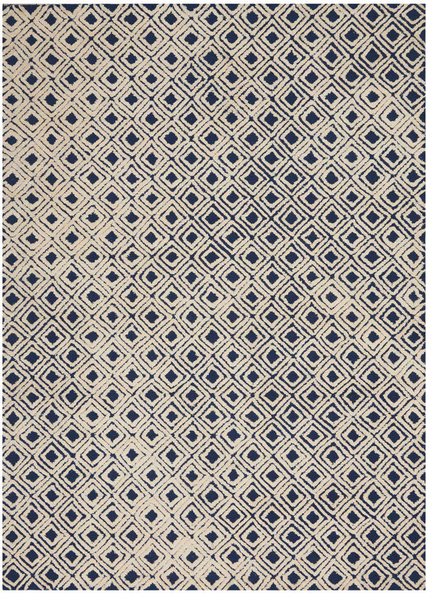 Close-up of the Nourison Deco Mod Navy Ivory rug, featuring a geometric diamond pattern and handmade texture.