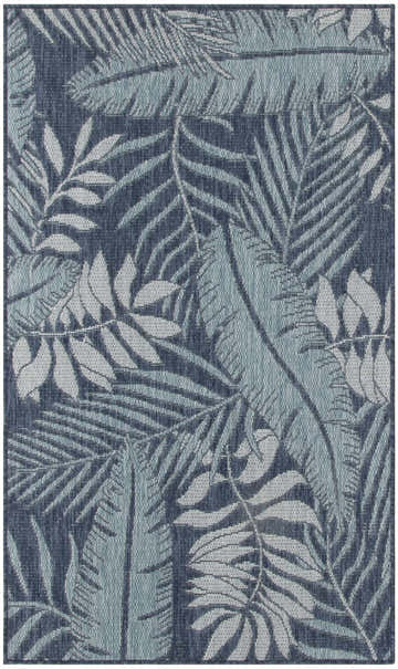 Close-up of the Nourison Garden Oasis Navy Outdoor Area Rug. Features a tropical leaf pattern in shades of navy, blue, and white.
