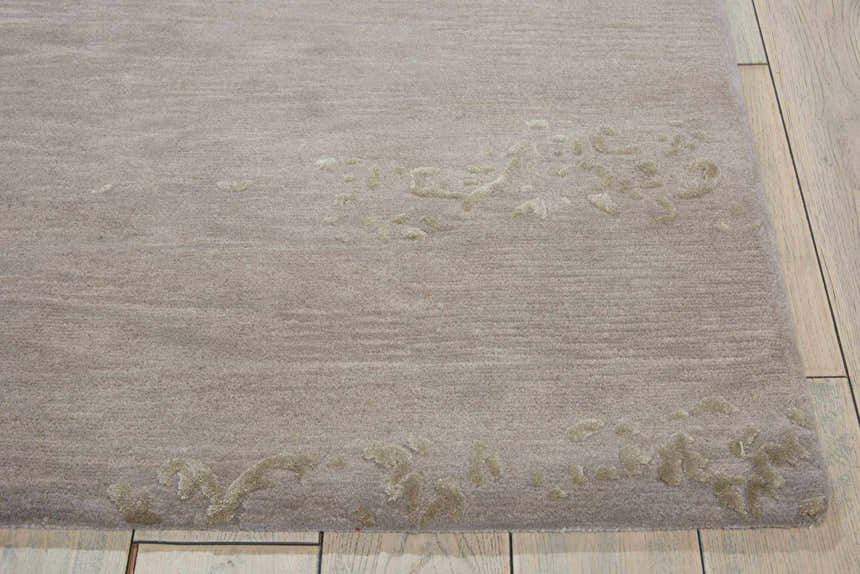 Close-up of the silver gray Nourison Opaline rug showing its subtle vintage pattern and soft texture.