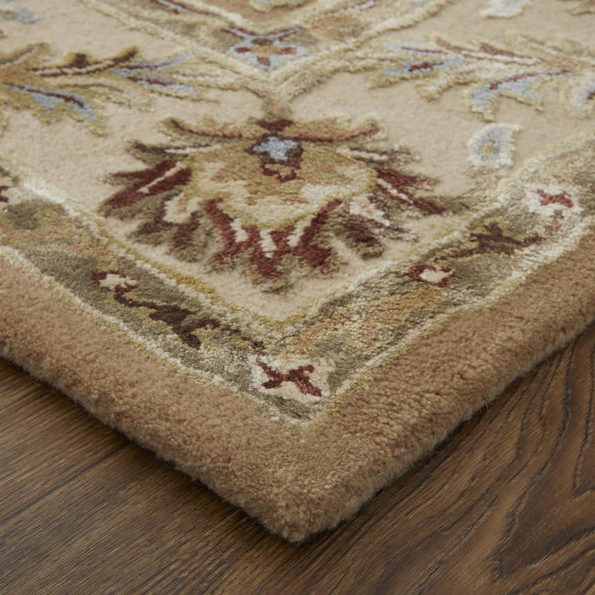 Close up of the Feizy Prescott Tan/Ivory Area Rug showing floral pattern and hand tufted texture. Corner