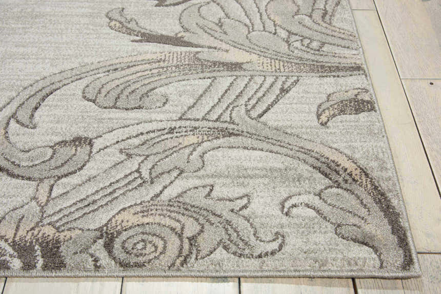 Close-up of the Nourison Maxell Graphite rug. Features a gray floral pattern and soft texture. Contemporary style.