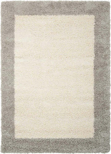 Close-up of the Nourison Amore Ivory Silver Shag Rug, featuring a plush ivory center and contrasting silver border.