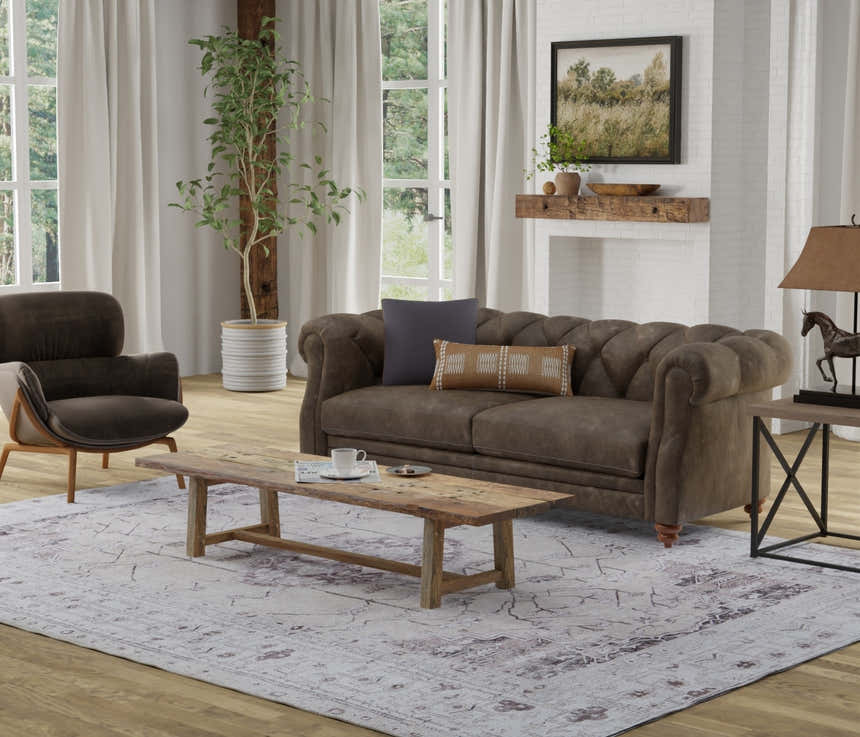 Living room scene with a Feizy Percy Tan/Ivory/Gray rug, brown sofa, and rustic wood coffee table. Roomscene-Rectangle