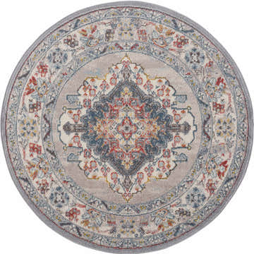 Close-up of a round Haymond Area Rug. Features a traditional floral pattern in brick red, charcoal, cream, and blue tones. Design-Round-53