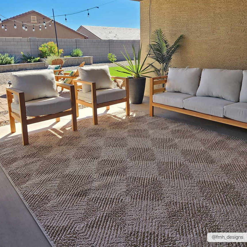 Outdoor patio with wood furniture and Broox Beige Area Rug. Neutral tones create a relaxing, modern farmhouse vibe. Roomscene-Rectangle