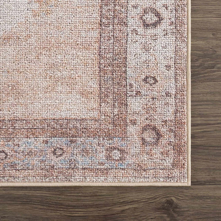 Close-up of the Analu Non-Slip Washable Rug. Features a traditional oriental pattern in brown, tan, and light blue hues. Swatch