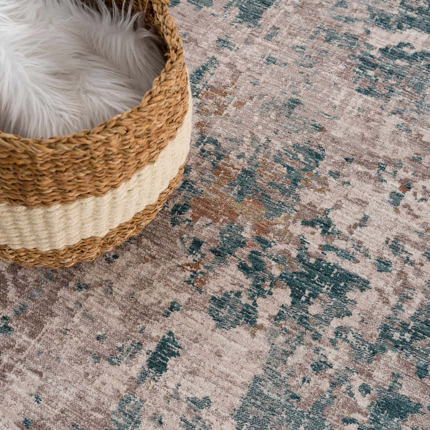 Close-up of the Danlugan Area Rug showing its charcoal, cream, and dusty pink contemporary design and textured weave. Styleshot