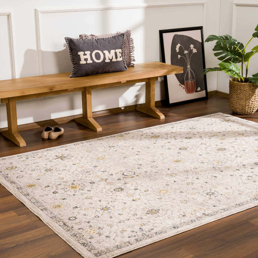 Entryway with Annie Cream Textured Rug, wood bench, floral art, and potted plant. Roomscene-Rectangle