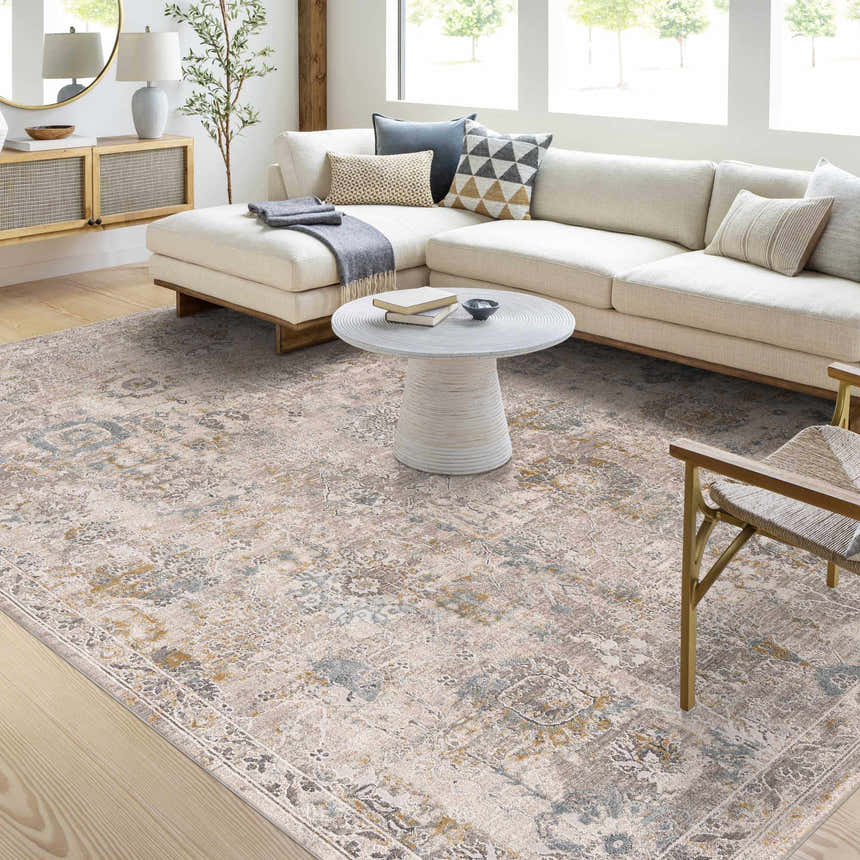 Living room scene with a neutral sofa and Alroy Textured Rug in gray, brown, and gold tones. Roomscene-Rectangle