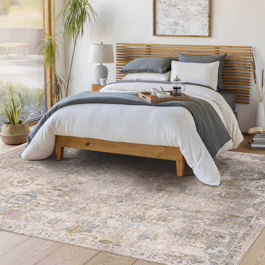 Bedroom scene with a light wood bed, and Alroy Textured Rug in gray, brown, and gold tones. Roomscene-Rectangle