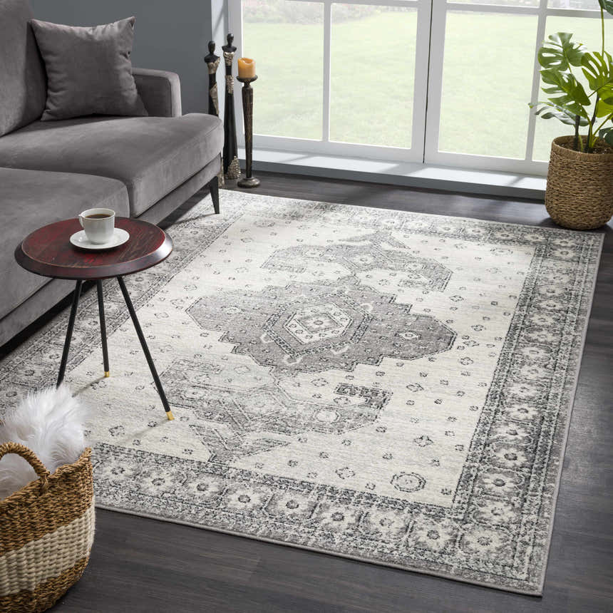 Living room scene with gray sofa and Marash 4605 Gray Area Carpet. Traditional rug with gray and ivory pattern. Roomscene-Rectangle