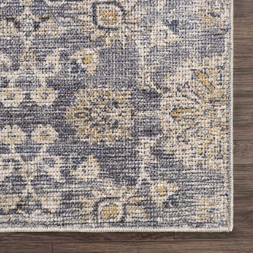 Close-up of the Metin Area Rug, showcasing its light gray, natural gray, and subtle yellow traditional pattern. Swatch