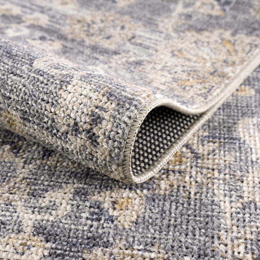 Close-up of the Metin Area Rug showing light gray and natural gray colors, woven texture, and backing. Fold