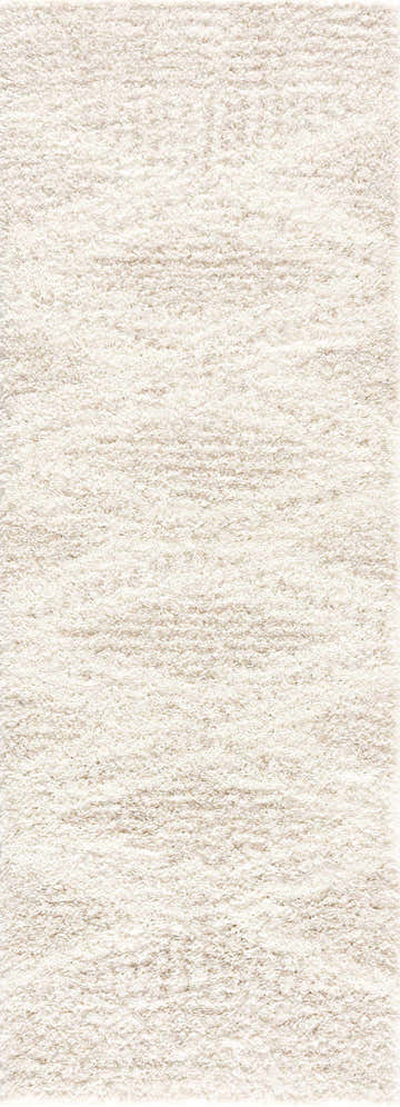 Close-up of the Hauteloom Trunding Plush Rug in Light Beige. Shag rug texture with cream and light beige tones. Design-Runner-2773