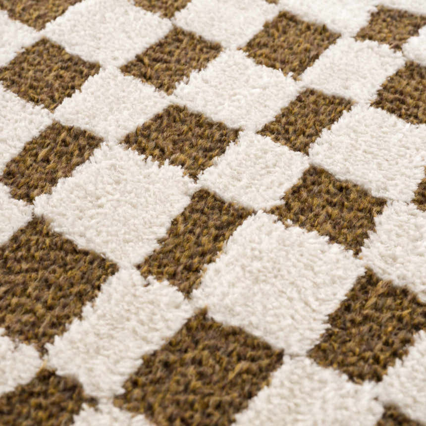 Close-up of the Lajos Brown Checkered Shag Rug, showcasing its plush texture and geometric beige and brown pattern. Texture