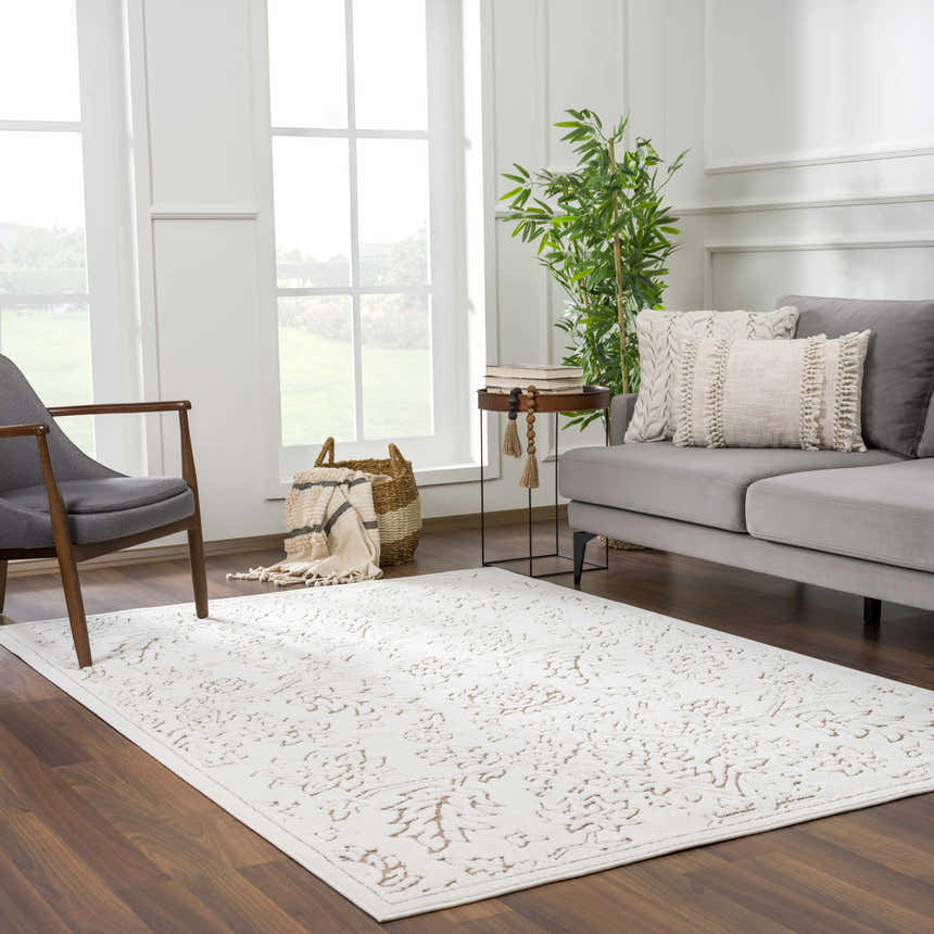 Living room scene with a gray sofa and Tabuan 3D Outdoor Area Rug in light peach and white thatch colors. Roomscene-Rectangle