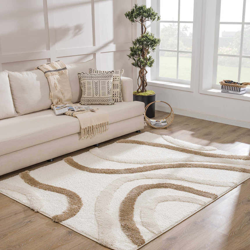 Living room scene with a neutral sofa and the Espiye Area Rug, a shag rug with brown wavy lines. Roomscene-Rectangle