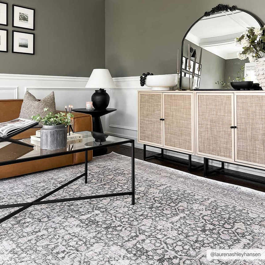 Living room with gray walls, brown sofa, and Hedda Boutique Washable Rug in dark gray. Farmhouse style with modern black accents. Roomscene-Rectangle