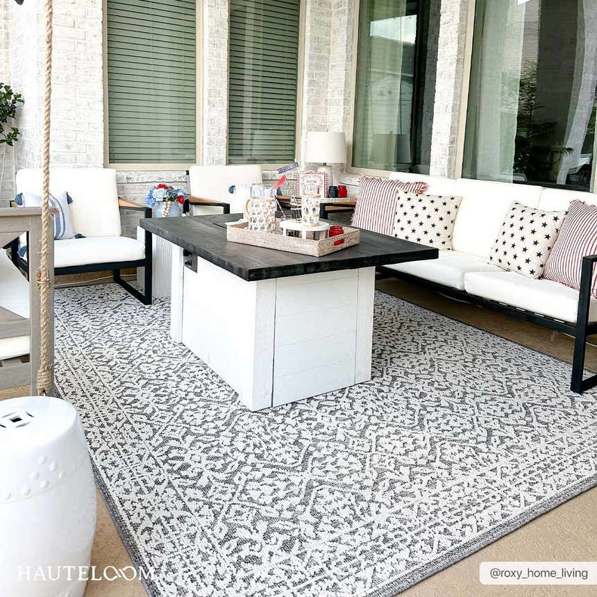 Covered patio with white furniture and gray patterned Kinglake Area Rug. Bohemian farmhouse style. Roomscene-Rectangle